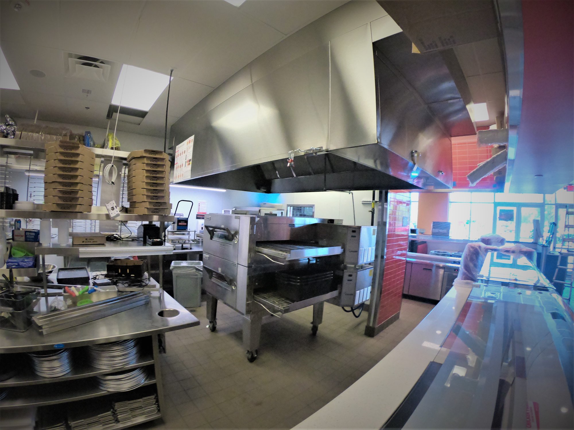 Restaurant kitchen finished build with red accents.